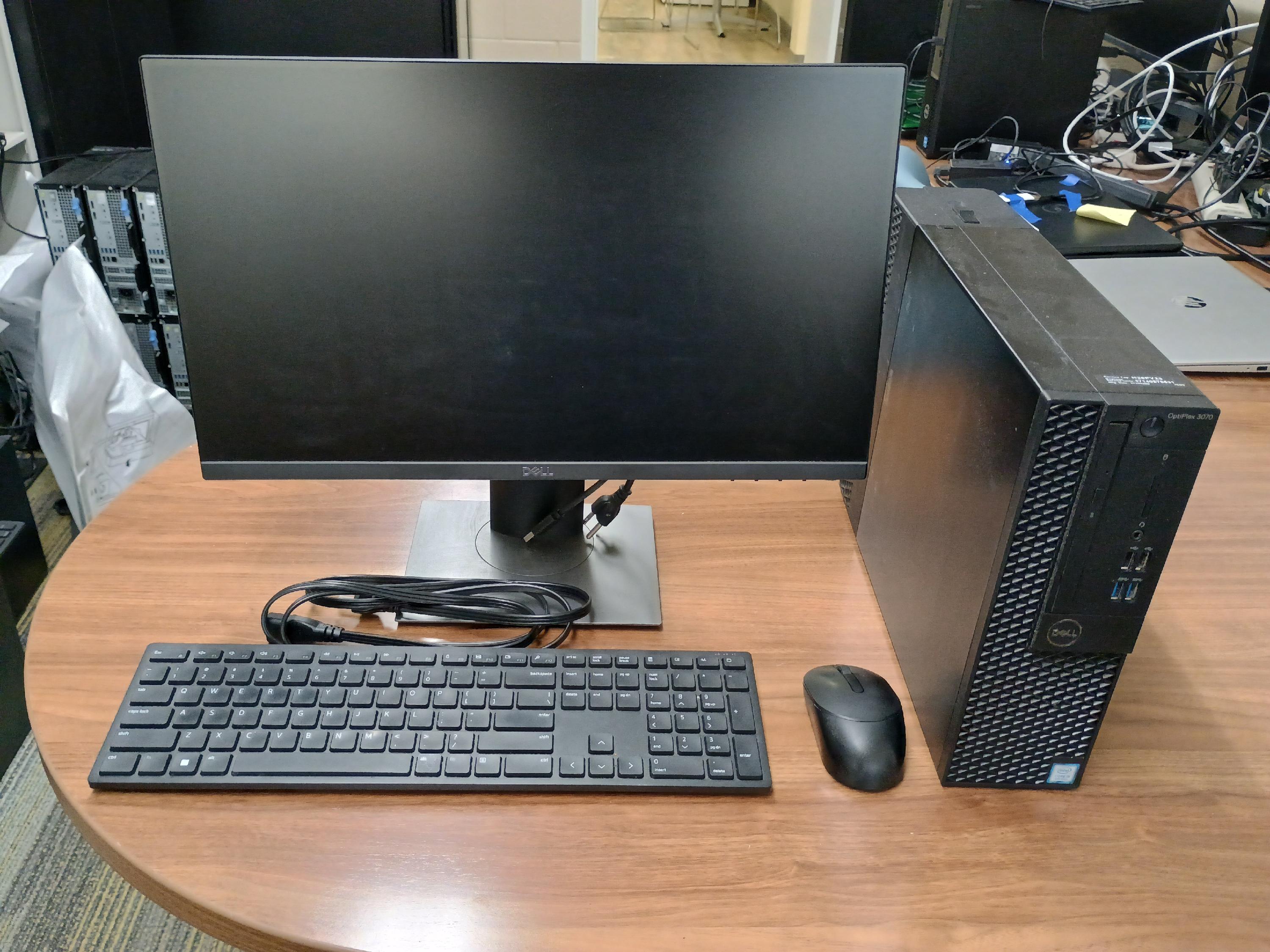 Desktop computer with mouse, keyboard, monitor and cables.